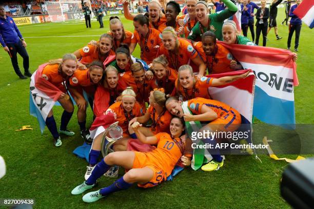 Netherlands' team players celebrate with the trophy after winning the UEFA Womens Euro 2017 football tournament final match between Netherlands and...