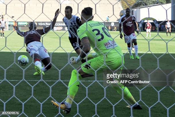 Bordeaux's French forward Alexandre Mendy scores a goal past Angers' French goalkeeper Alexandre Letellier during the French L1 football match...
