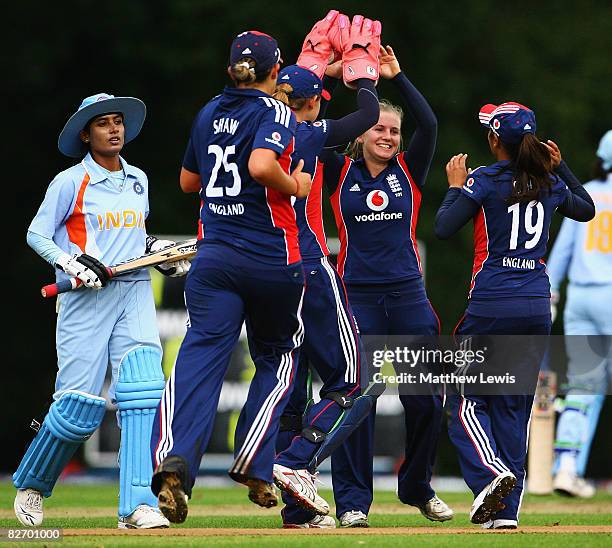 Holly Colvin of England is congratulated on the wicket of Mithali Raj of India during the One Day International between England Women and India Women...