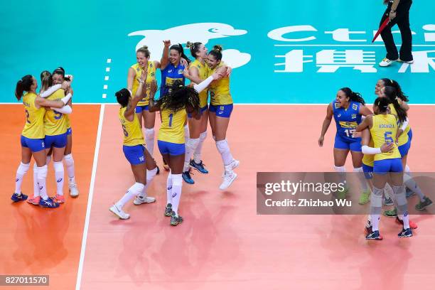 Players of Brazil celebrate after winning 2017 Nanjing FIVB World Grand Prix Finals between Italy and Brazil on August 6, 2017 in Nanjing, China.