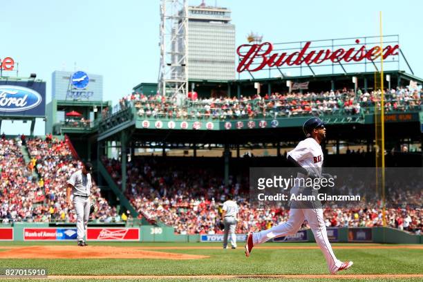 Mike Pelfrey of the Chicago White Sox looks on as Eduardo Nunez of the Boston Red Sox rounds the bases after hitting a solo home run in the first...
