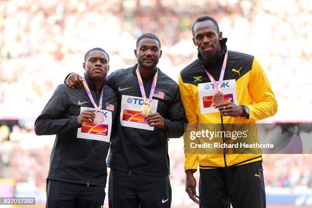 Christian Coleman of the United States, silver, Justin Gatlin of the United States, gold, and Usain Bolt of Jamaica, broze pose with their medals for...