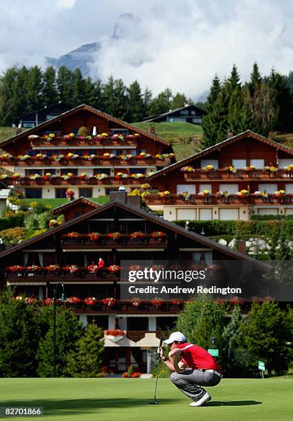 Rory McIlroy of Northern Ireland prepares to putt on the 14th hole during the final round of the Omega European Masters at Crans-Sur-Sierre Golf Club...