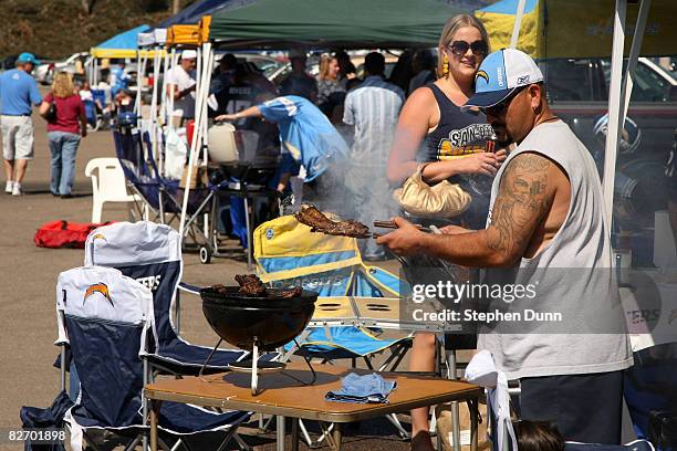 Chargers fans tailgate in the parking lot before the game between the Carolina Panthers and the San Diego Chargers on September 7, 2008 at Qualcomm...