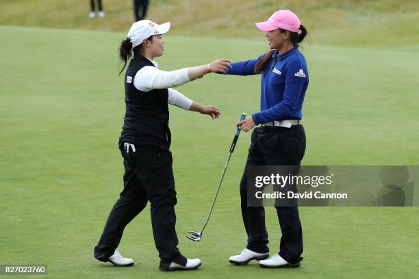 In-Kyung Kim of Korea celebrates victory on the 18th green with Moriya Jutanugarn of Thailand during the final round of the Ricoh Women's British...