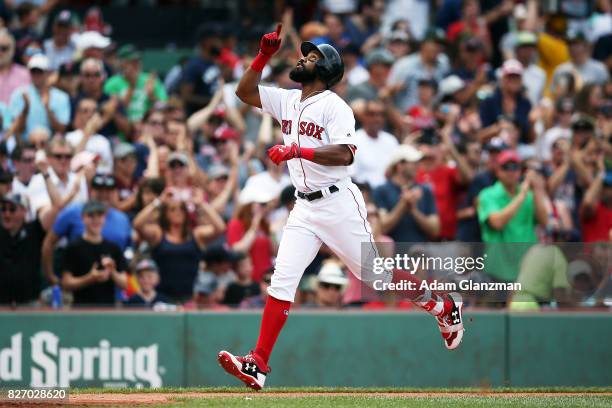 Chris Young of the Boston Red Sox reacts as he rounds the bases after hitting a three-run home run in the fifth inning of a game against the Chicago...