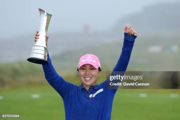 In-Kyung Kim of South Korea holds the trophy after her victory during the final round of the Ricoh Women's British Open at Kingsbarns Golf Links, on...