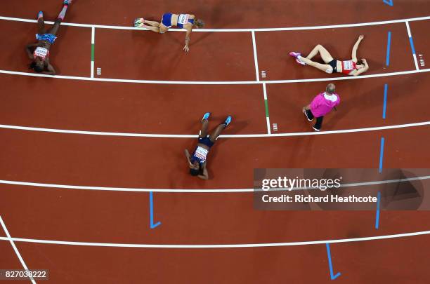 Athletes in heat two of the Women's Heptathlon 800 metres colapse at the finish during day three of the 16th IAAF World Athletics Championships...