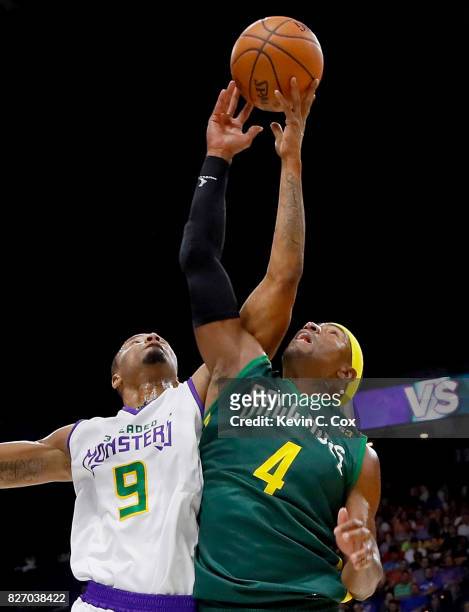 Rashard Lewis of the 3 Headed Monsters battles for possession against Derrick Byars of the Ball Hogs during week seven of the BIG3 three on three...