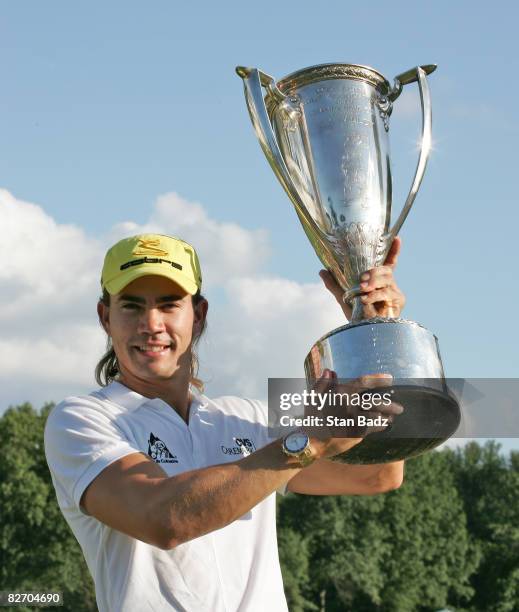 Camilo Villegas holds the winner's trophy after the final round of the BMW Championship held at Bellerive Country Club on September 7, 2008 in St....