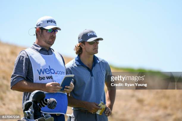 William Kropp talks with his caddy on the second tee during the final round of the Web.com Tour Ellie Mae Classic at TPC Stonebrae on August 6, 2017...
