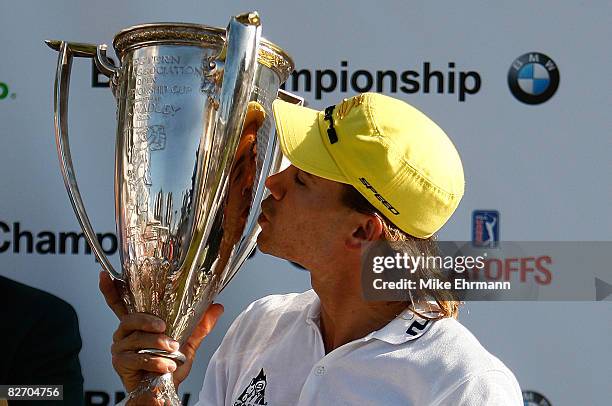 Camilo Villegas hoists the trophy after winning the BMW Championship on September 7, 2008 at Bellerive Country Club in St. Louis, Missouri.