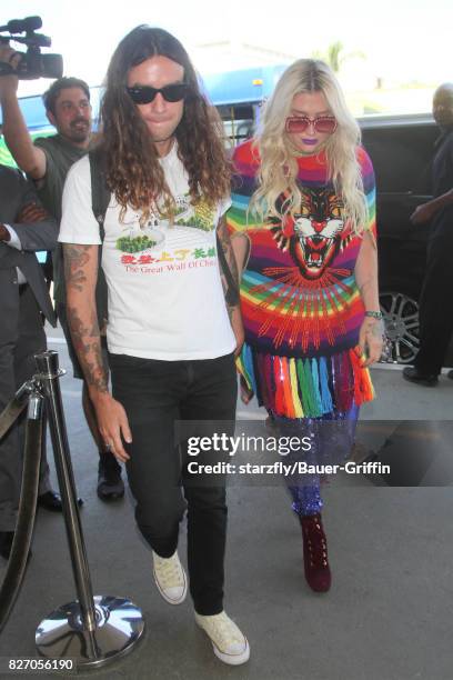 Kesha and Brad Ashenfelter are seen at LAX on August 06, 2017 in Los Angeles, California.