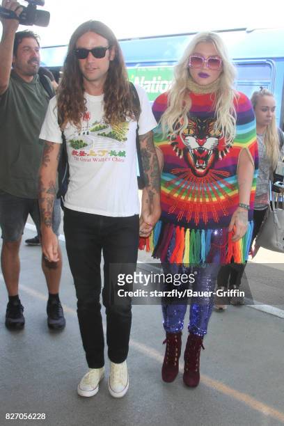 Kesha and Brad Ashenfelter are seen at LAX on August 06, 2017 in Los Angeles, California.