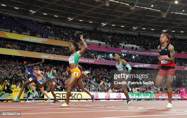 Tori Bowie of the United States races to the finishline ahead of Marie-Josee Ta Lou of the Ivory Coast and Dafne Schippers of the Netherlands to win...