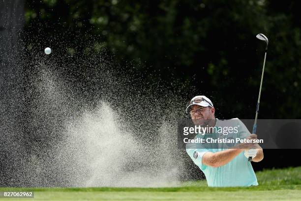 Robert Garrigus plays his shot out of the bunker on the 16th hole during the final round of the Barracuda Championship at Montreux Country Club on...