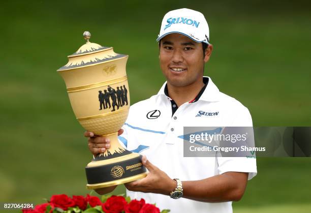 Hideki Matsuyama of Japan holds the Gary Player Cup after winning the World Golf Championships - Bridgestone Invitational during the final round at...