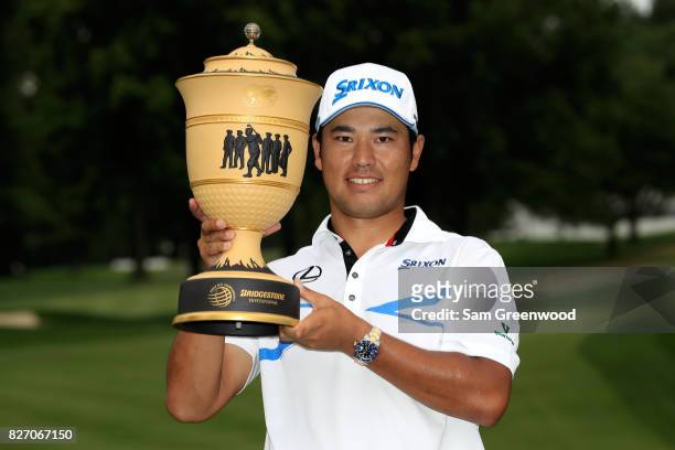 Hideki Matsuyama of Japan holds the Gary Player Cup after winning the World Golf Championships - Bridgestone Invitational during the final round at...