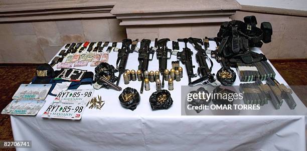 Guns and munitions confiscated to alleged Mexican drug dealers Alberto Sanchez Hinojosa aka "El Tony", Francisco Arteaga Espino and Leonel Cruz...