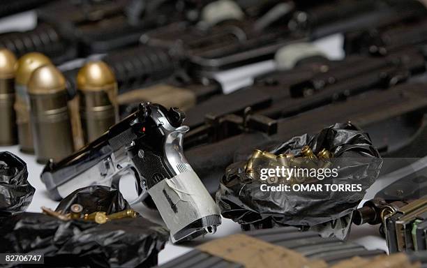 Guns and munitions confiscated to alleged Mexican drug dealers Alberto Sanchez Hinojosa aka "El Tony", Francisco Arteaga Espino and Leonel Cruz...