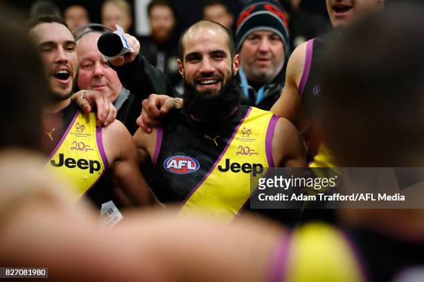 Bachar Houli of the Tigers sings the team song during the 2017 AFL round 20 match between the Richmond Tigers and the Hawthorn Hawks at the Melbourne...