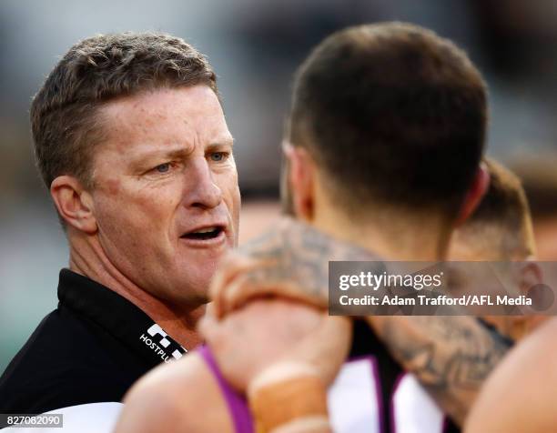 Damien Hardwick, Senior Coach of the Tigers addresses his players during the 2017 AFL round 20 match between the Richmond Tigers and the Hawthorn...