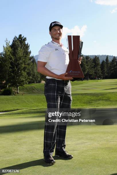 Chris Stroud poses with the trophy after putting in to win during a second play-off hole during the final round of the Barracuda Championship at...