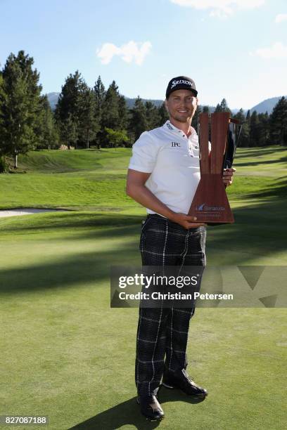 Chris Stroud poses with the trophy after putting in to win during a second play-off hole during the final round of the Barracuda Championship at...