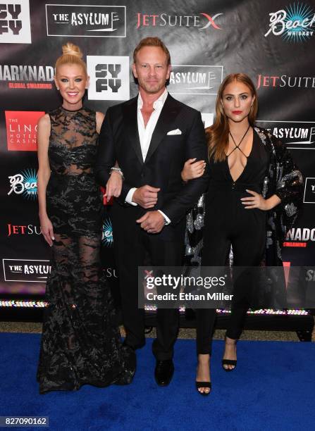 Actress Tara Reid, actor Ian Ziering and actress Cassie Scerbo attend the premiere of "Sharknado 5: Global Swarming" at The LINQ Hotel & Casino on...