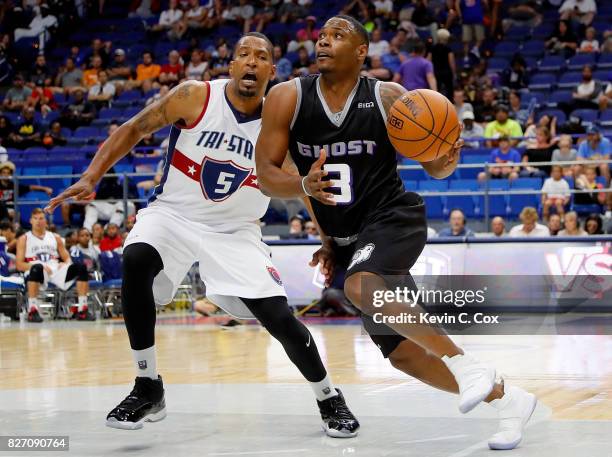 Marcus Banks of Ghost Ballers drives past Dominic McGuire of Tri-State during week seven of the BIG3 three on three basketball league at Rupp Arena...