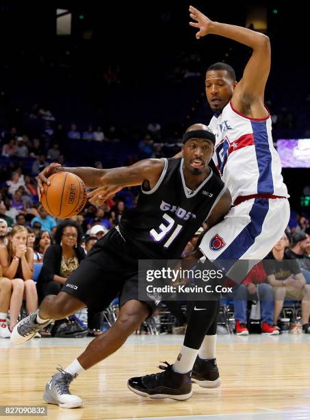 Ricky Davis of Ghost Ballers drives past Dominic McGuire of Tri-State during week seven of the BIG3 three on three basketball league at Rupp Arena on...