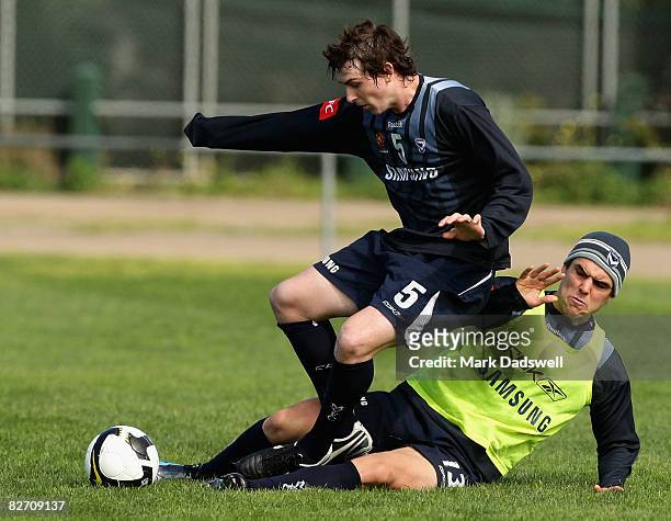 Sebastian Ryall of the Victory battles with Nathan Elasi during a Melbourne Victory Football Club training session at Gosch's Paddock on September 8,...