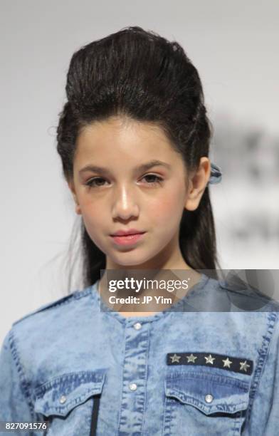 Young model walks the runway for Blu and Blue collection during petitePARADE at Children's Club at Jacob Javitz Center on August 6, 2017 in New York...