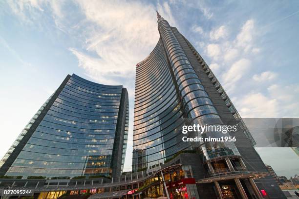 street view of the unicredit tower entrance in piazza gae aulenti, milan-italy - ambientazione esterna imagens e fotografias de stock