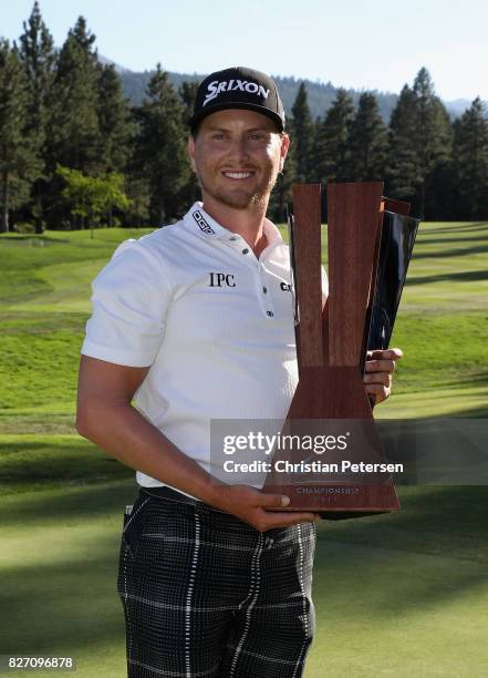 Chris Stroud poses with the trophy after putting in to win during a second play-off hole in the final round of the Barracuda Championship at Montreux...