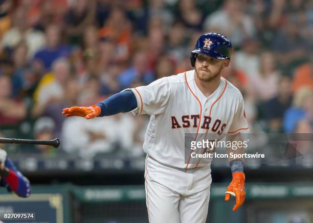 Houston Astros left fielder Derek Fisher throws his bat and gets a walk to first base in the seventh inning of the MLB game between the Tampa Bay...