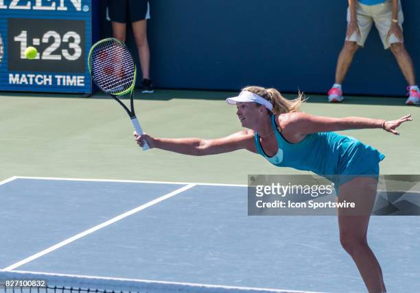 CoCo Vandeweghe reaches for a ball near the net during a WTA singles championship round at the Bank of the West Classic between at the Taube Family...