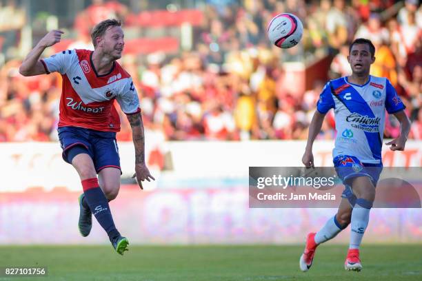 Cristian Menendez of Veracruz and Alonso Zamora of Puebla vie for the ball during the 3rd round match between Veracruz and Puebla as part of the...