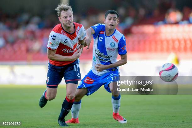 Cristian Menendez of Veracruz and Alonso Zamora of Puebla fight for the ball during the 3rd round match between Veracruz and Puebla as part of the...