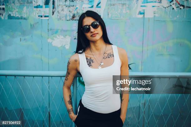 young beautiful woman in the hood enjoying summertime day - tank top stock pictures, royalty-free photos & images