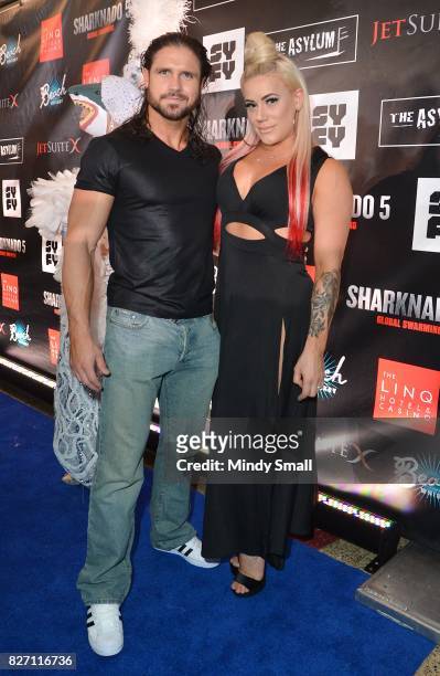 Pro Wrestler John Hennigan and wrestler Taya Valkyrie attend the premiere of "Sharknado 5: Global Swarming" at The Linq Hotel & Casino on August 6,...