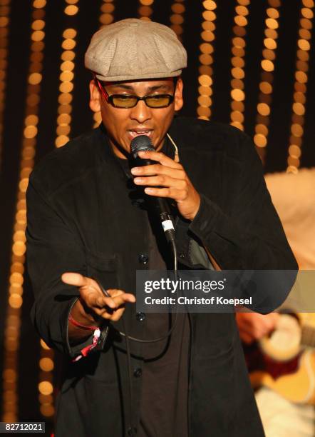 Singer Xavier Naidoo and the Soehne Mannheims sing during the Day of Legends gala night at the Schmitz Tivoli theatre on September 7, 2008 in...