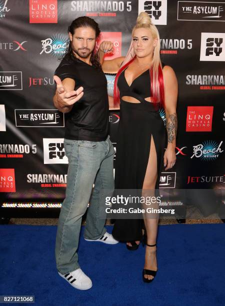 Actor/professional wrestler John Hennigan and his fiancee, professional wrestler/model Kira Forster, attend the premiere of "Sharknado 5: Global...