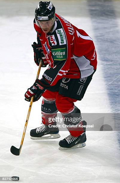 Christoph Ullmann of the Koelner Haie leads the puck during the DEL match between Koelner Haie and Eisbaeren Berlin at the Lanxess Arena on September...