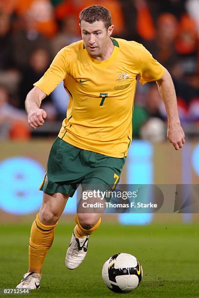 Brett Emerton of Australia runs with the ball during the International friendly match between Holland and Australia at the Phillips Stadium on...