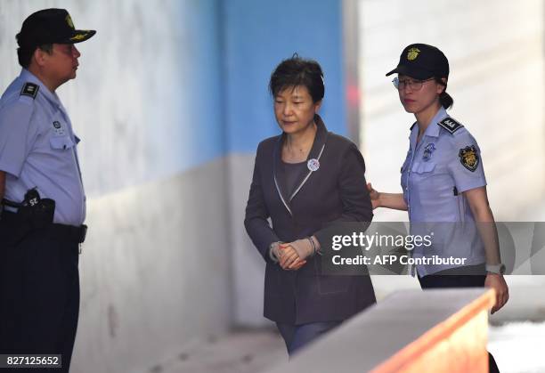 South Korea's ousted president Park Geun-Hye arrives at the Seoul Central District Court in Seoul on August 7, 2017 for her trial over the massive...