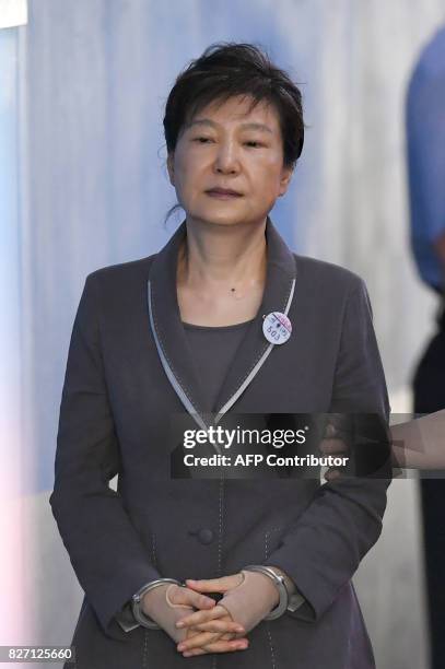 South Korea's ousted president Park Geun-Hye arrives at the Seoul Central District Court in Seoul on August 7, 2017 for her trial over the massive...