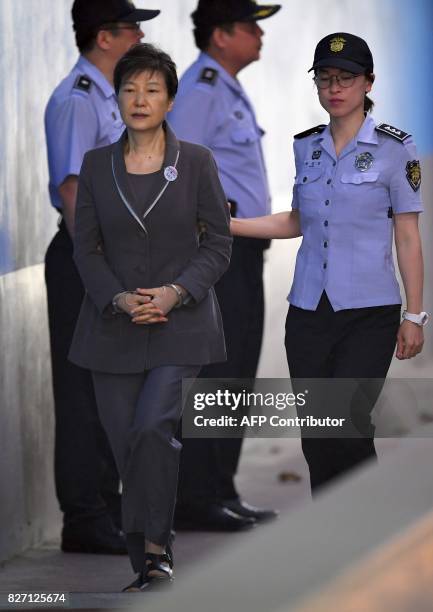 South Korea's ousted president Park Geun-Hye arrives at the Seoul Central District Court in Seoul on August 7, 2017 for her trial over the massive...