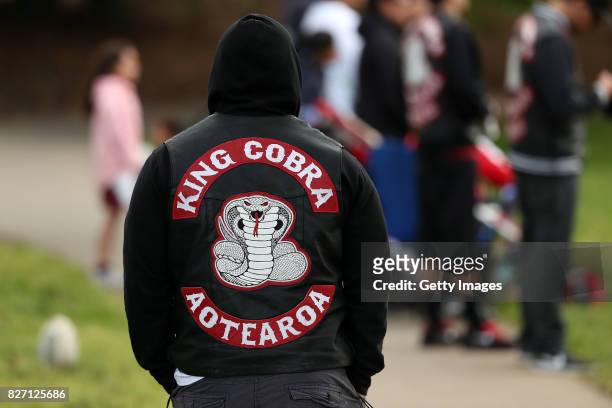Members of the King Cobra gang watch club rugby league at Grey Lynn Park on August 5, 2017 in Auckland, New Zealand. The King Cobra Aotearoa gang was...