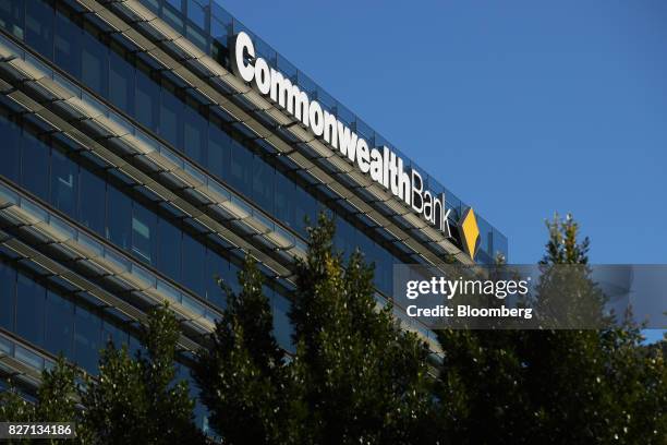 Signage for Commonwealth Bank of Australia is displayed atop the Commonwealth Bank Place building in Sydney, Australia, on Monday, Aug. 7, 2017....